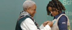 Girl Scout getting Gold Award pin