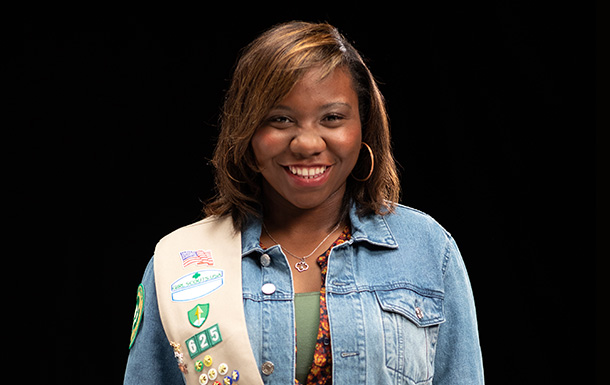 Portrait of a Girl Scout smiling at the camera.