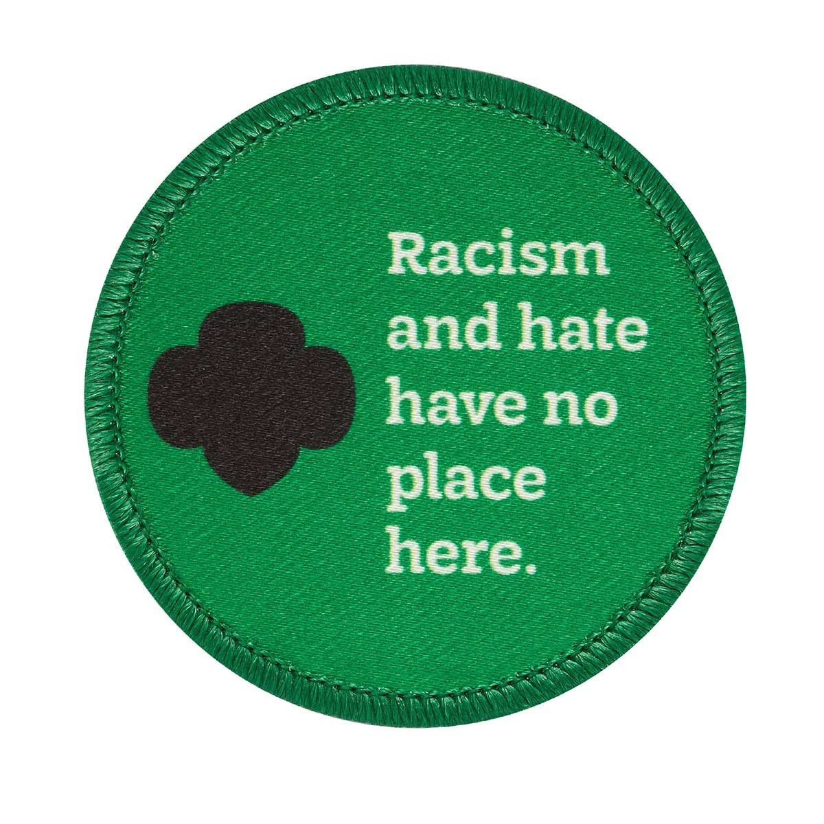 Green with black trefoil and Racism and hate have no place here.