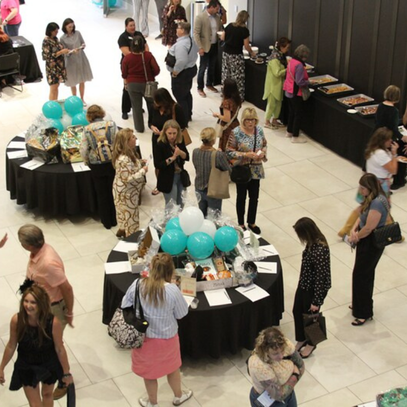 Crowd of individuals at Cookies, Cocktails, and Confections